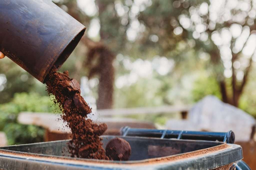 Cafe recycles used coffee for composting on urban farm garden